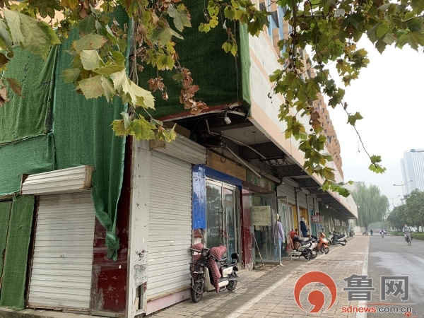鲁网|济南五里牌坊拆迁房临街商户依然在经营 存安全隐患受市民质疑
